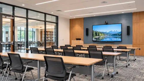 Institutional training room with seating and presentation display